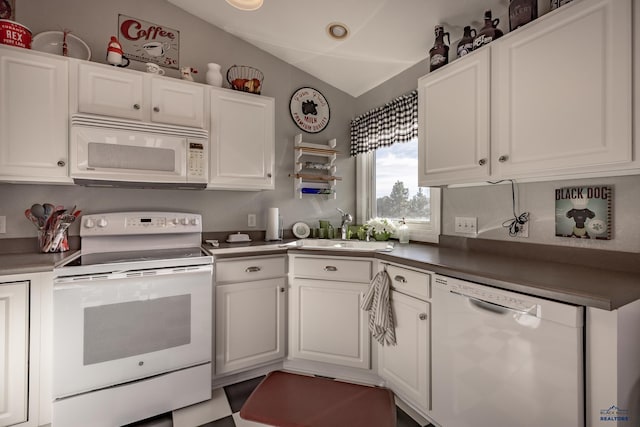 kitchen featuring lofted ceiling, sink, white cabinets, and white appliances