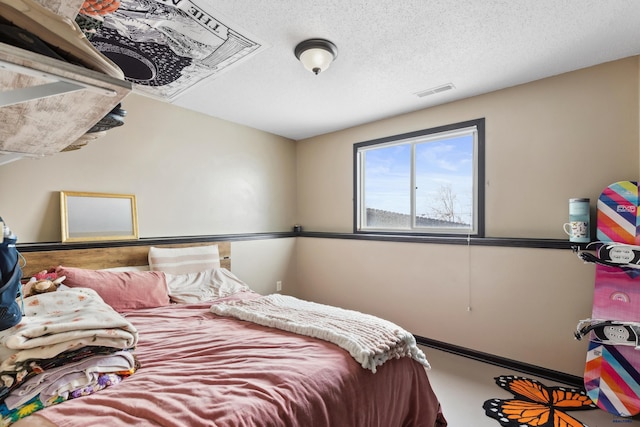 bedroom featuring a textured ceiling