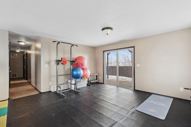 exercise area with a textured ceiling