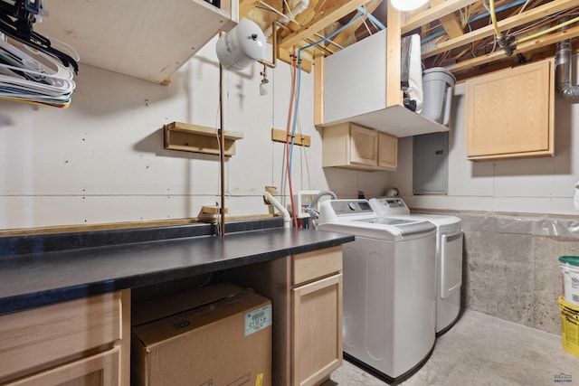 washroom with cabinets and washer and clothes dryer