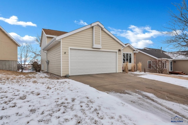 view of front of home with a garage