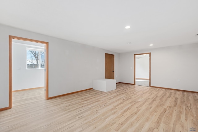 empty room with light hardwood / wood-style floors