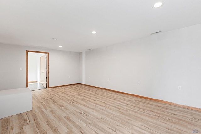 empty room with light hardwood / wood-style floors