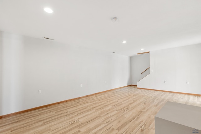 spare room featuring light wood-type flooring