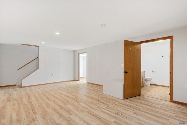 empty room with light hardwood / wood-style floors