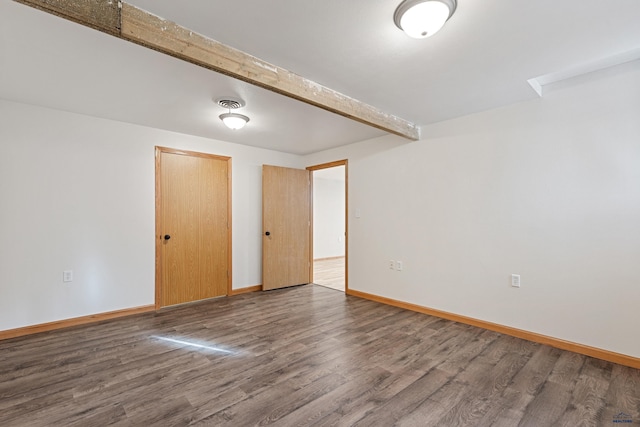 unfurnished room with hardwood / wood-style flooring