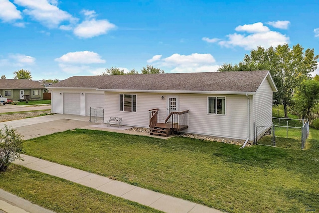 ranch-style house featuring a front lawn and a garage