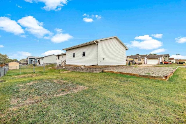 exterior space with a yard and a garage