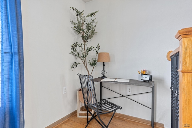 office with light hardwood / wood-style flooring