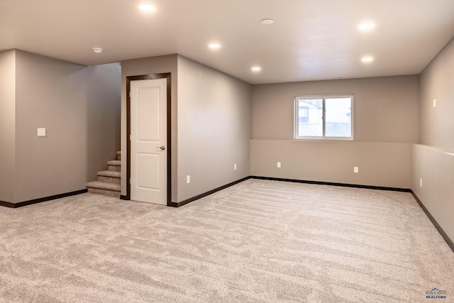 empty room featuring light colored carpet