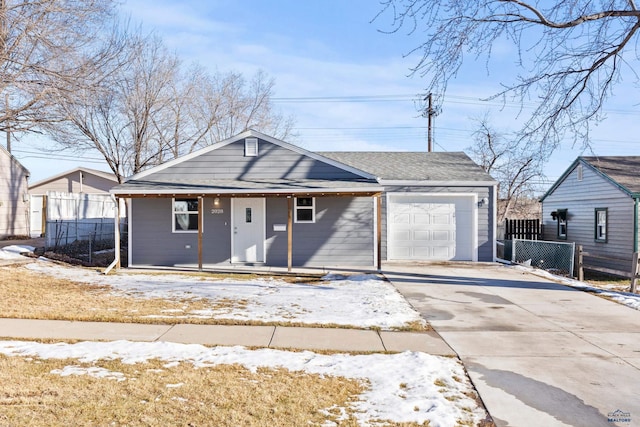 single story home with a porch and a garage