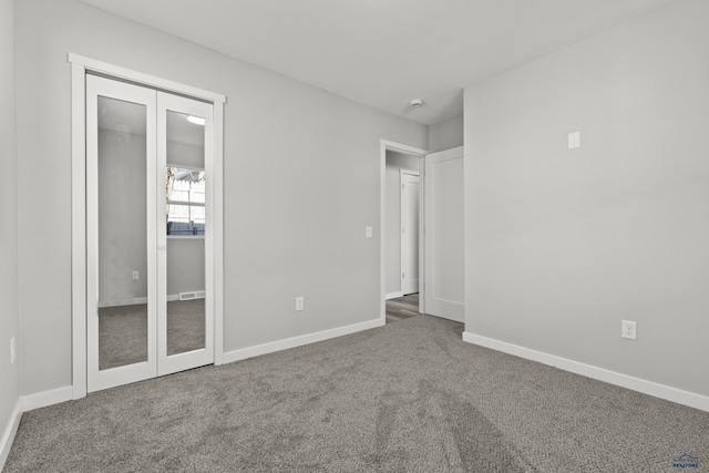 unfurnished bedroom with carpet floors