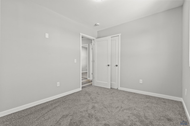 unfurnished bedroom with carpet flooring