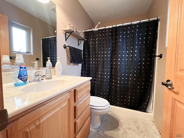 bathroom with tile patterned flooring, toilet, vanity, and a shower with shower curtain