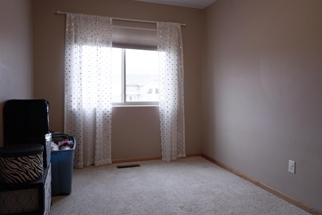 living area with light carpet