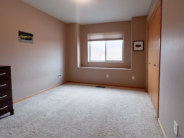 unfurnished room with carpet