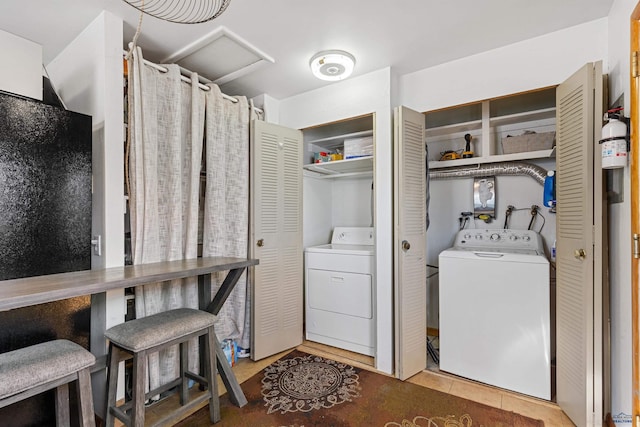 1002 Allen Ave, Rapid City, SD 57701 - laundry area with washer / dryer and light tile patterned floors