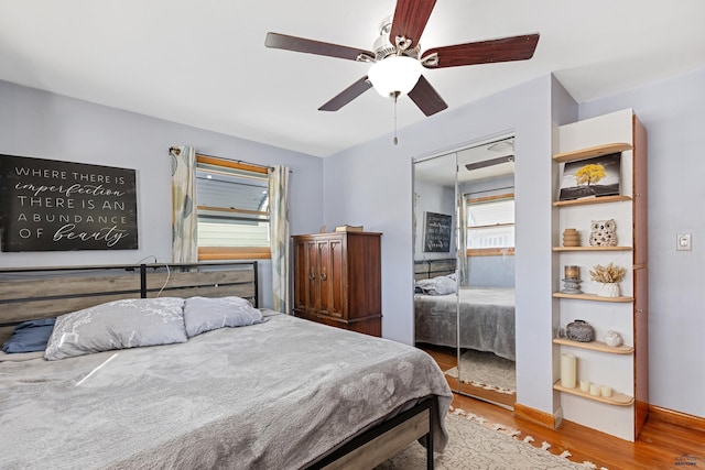 1002 Allen Ave, Rapid City, SD 57701 - bedroom with a closet, wood-type flooring, and ceiling fan