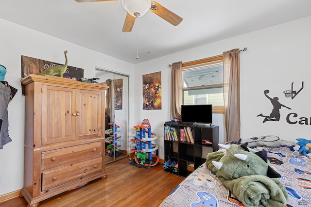 1002 Allen Ave, Rapid City, SD 57701 - bedroom featuring ceiling fan, a closet, and hardwood / wood-style floors