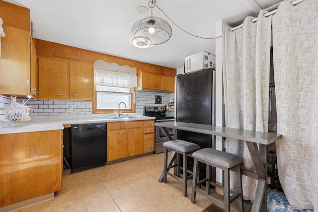 1002 Allen Ave, Rapid City, SD 57701 - kitchen with backsplash, stainless steel electric range, sink, black dishwasher, and a kitchen breakfast bar