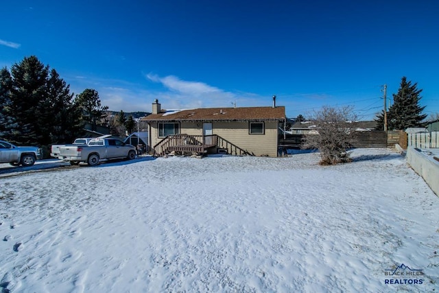 view of snow covered house