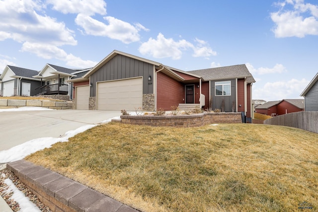 single story home with a garage and a front lawn