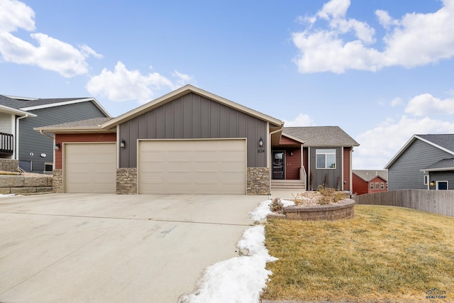 view of front of home featuring a front yard and a garage