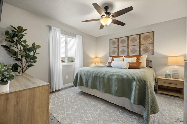 carpeted bedroom with ceiling fan