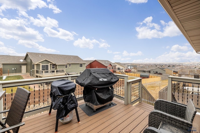 wooden terrace with a grill