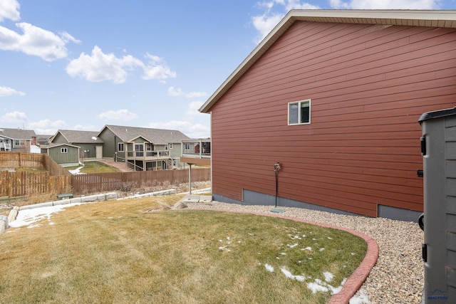 view of side of home featuring a lawn