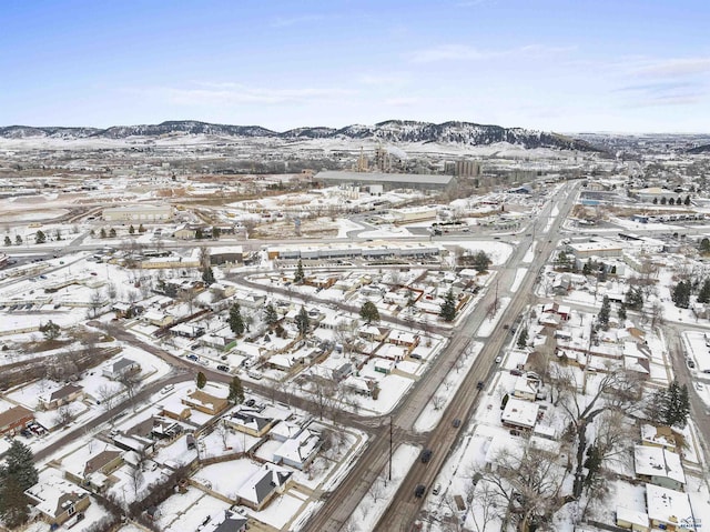 snowy aerial view with a mountain view