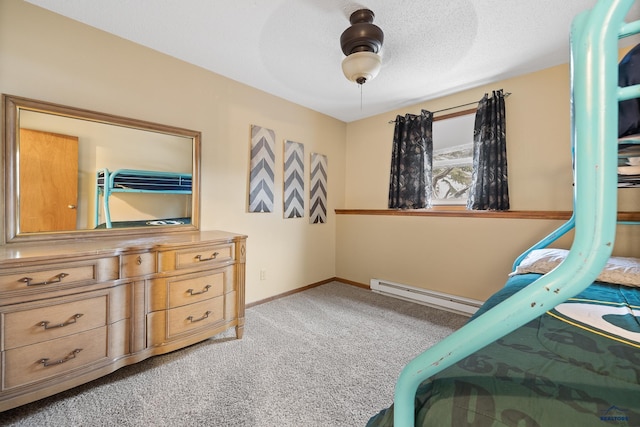 carpeted bedroom with a textured ceiling, ceiling fan, and baseboard heating