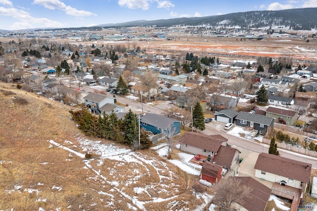 snowy aerial view with a mountain view