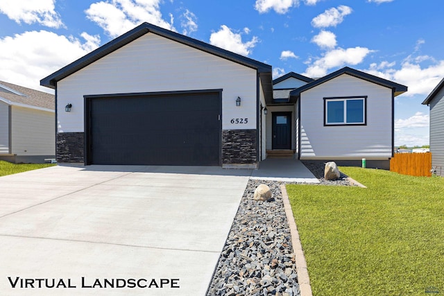 view of front of house with a front lawn and a garage