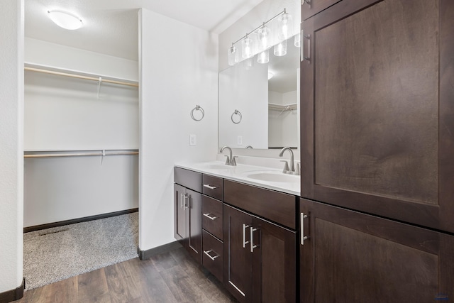 bathroom featuring vanity and hardwood / wood-style flooring