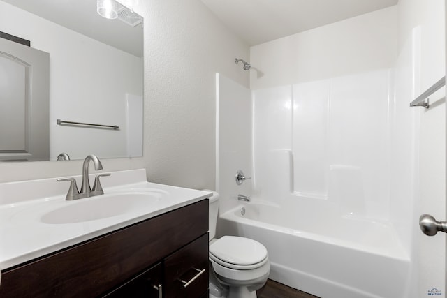 full bathroom featuring toilet, vanity, and shower / bath combination