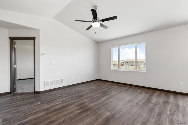 empty room featuring ceiling fan, dark hardwood / wood-style flooring, and lofted ceiling