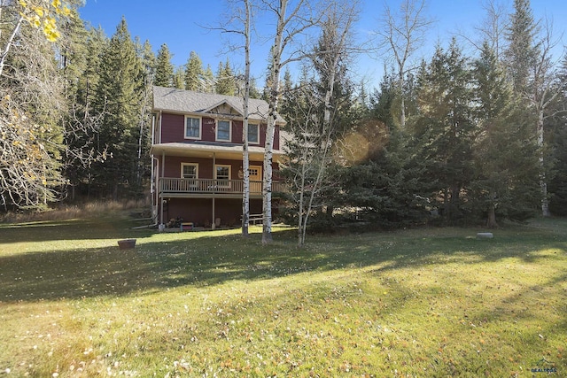 view of front of home featuring covered porch and a front lawn