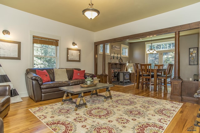 living room with light hardwood / wood-style floors and an inviting chandelier