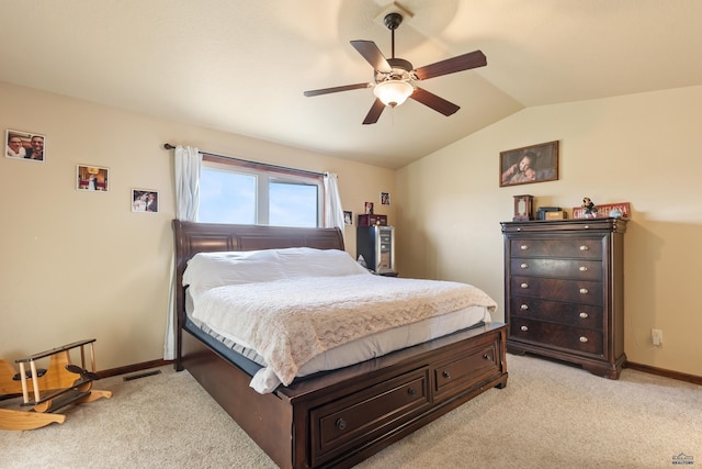 carpeted bedroom featuring lofted ceiling and ceiling fan