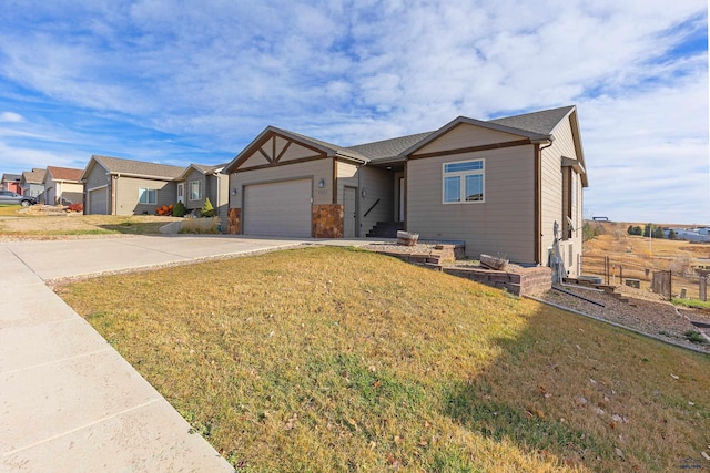 ranch-style home with a front lawn and a garage