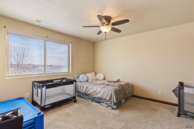 carpeted bedroom featuring ceiling fan