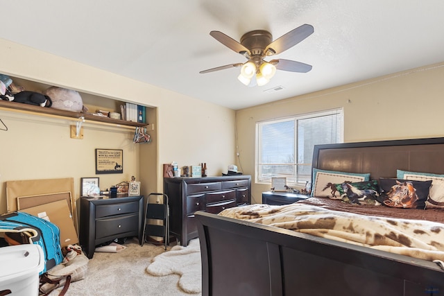 bedroom featuring ceiling fan and light carpet