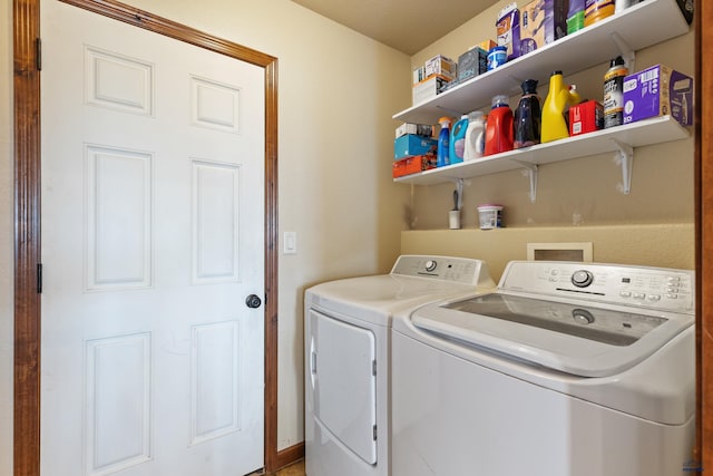 clothes washing area featuring washing machine and clothes dryer