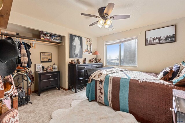 carpeted bedroom with ceiling fan