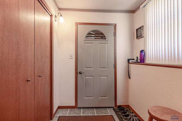 entryway featuring light tile patterned floors and ornamental molding