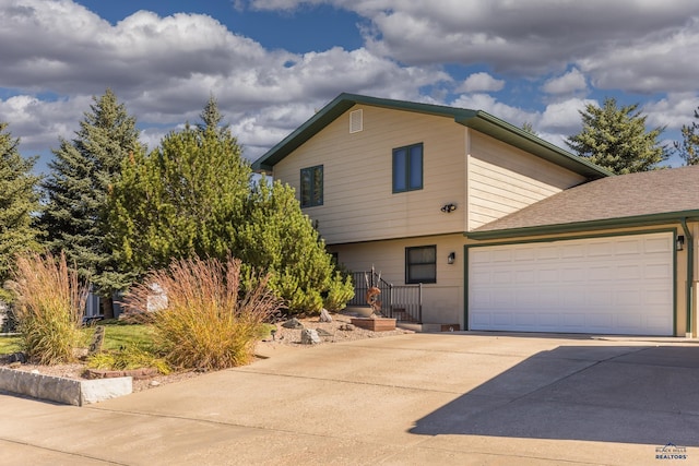 view of front of property featuring a garage