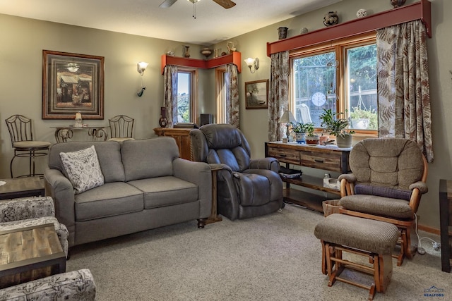 living room featuring ceiling fan and carpet