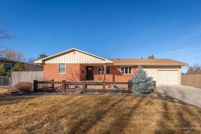 ranch-style house with a front lawn and a garage