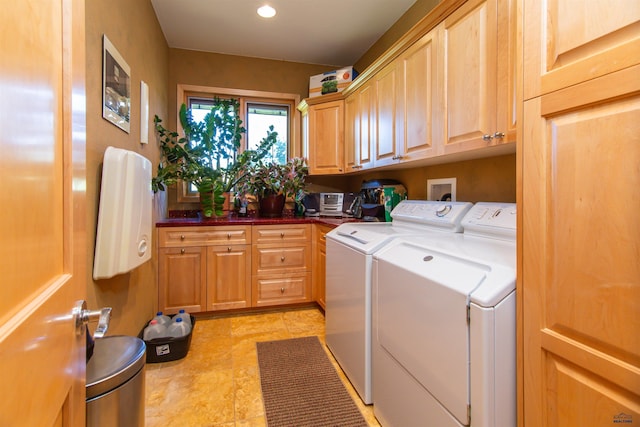 laundry area with cabinets, light tile patterned floors, and independent washer and dryer